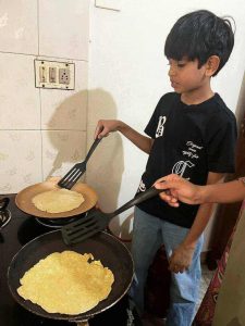 children learning basics of cooking during life skill camp